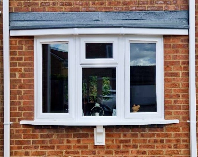 White uPVC Bay Window with Central Top opener installed on a house in Bourne