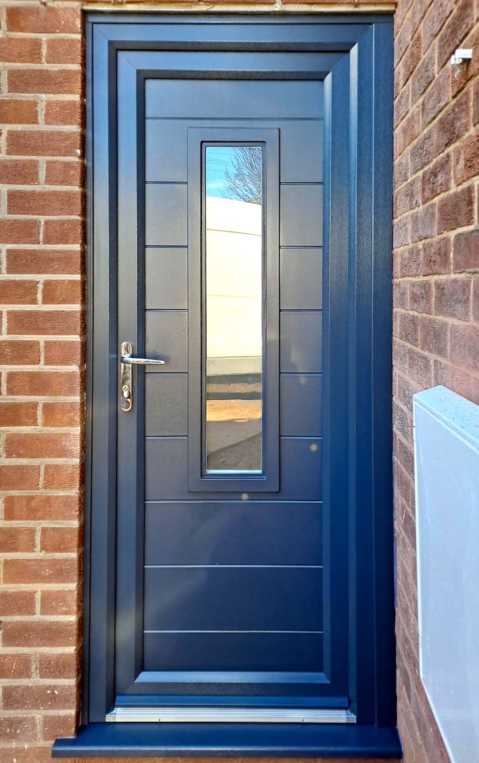 Decklap Anthracite Grey uPVC Door with Central Glazing Installed on a Home in Boston